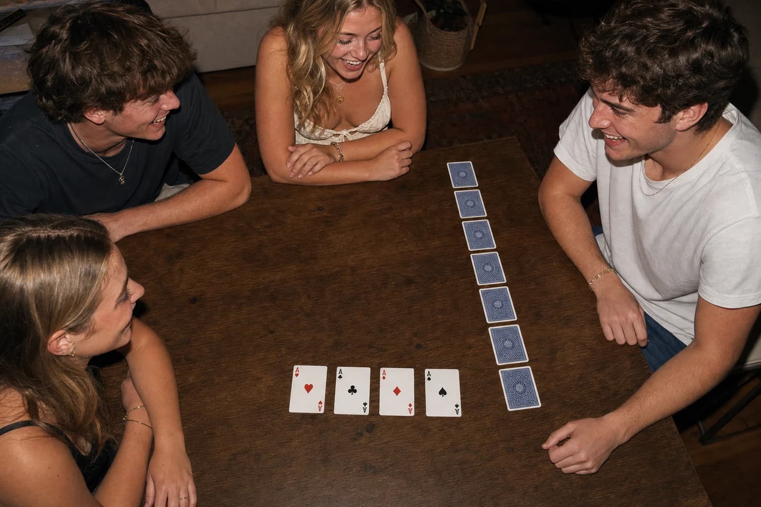 Four horizontal aces race beside a vertical seven-card track